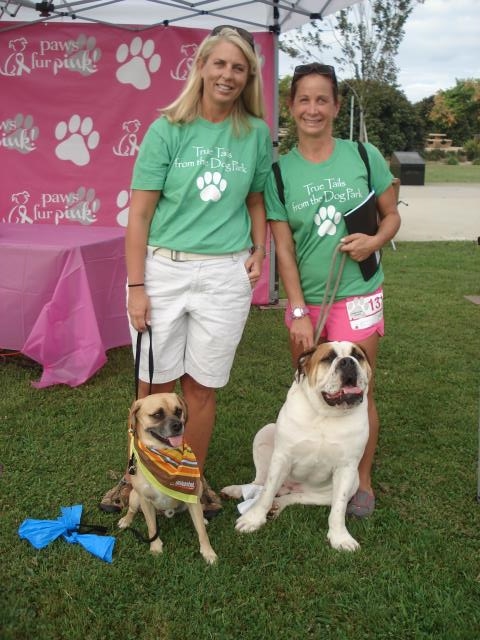 Authors Kari Sherman with her dog Max and Carey Laubenberg with Luther.